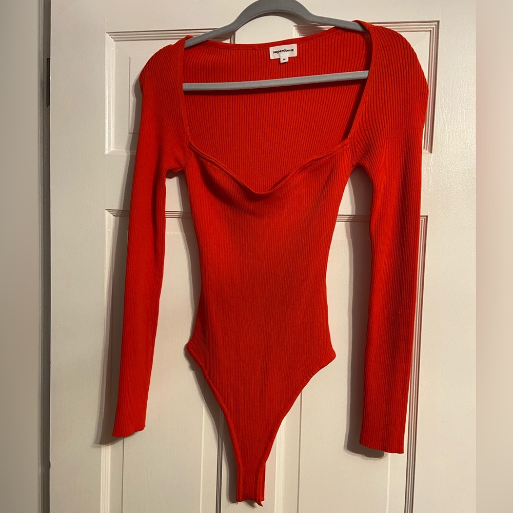 Orange Superdown bodysuit from Revolve.